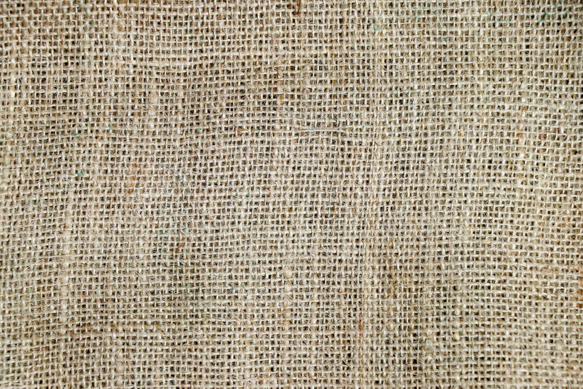 Texture of rough rustic fabric with traces of processing